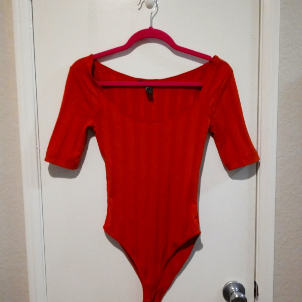 Burnt orange bodysuit never warn